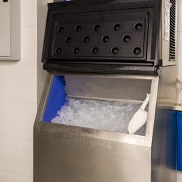 commercial ice machine in the corner of a restaurant